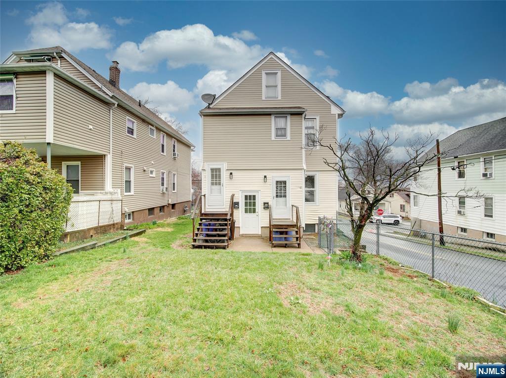 140 Westervelt Avenue Hawthorne, NJ 07506 - Photo 3 of 36 a view of a house with backyard and sitting area