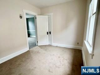 140 Westervelt Avenue Hawthorne, NJ 07506 - Photo 32 of 36 an empty room with windows