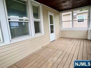 140 Westervelt Avenue Hawthorne, NJ 07506 - Photo 35 of 36 a view of a balcony with door and wooden floor