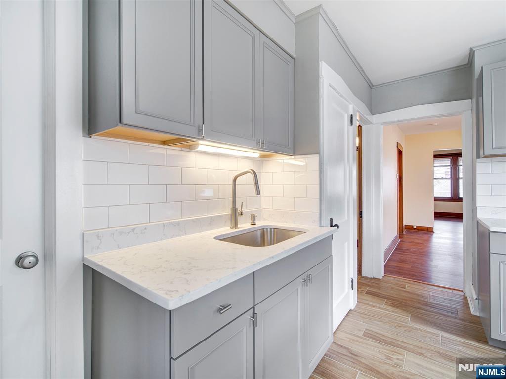 140 Westervelt Avenue Hawthorne, NJ 07506 - Photo 9 of 36 a kitchen with a sink and cabinets
