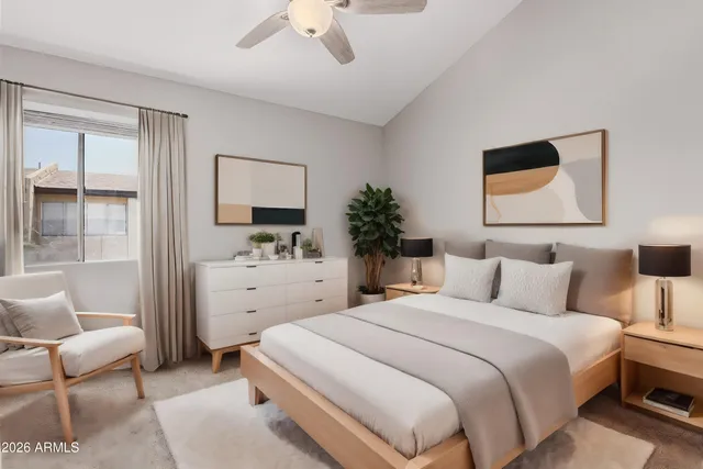 a bedroom with a bed and a couch