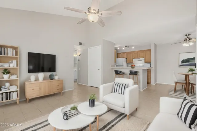 a living room with furniture and a flat screen tv