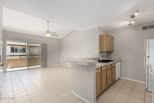 a kitchen with stainless steel appliances granite countertop a stove and a sink
