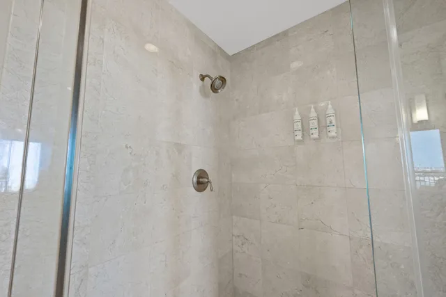 a spacious bathroom with a granite countertop sink and a mirror