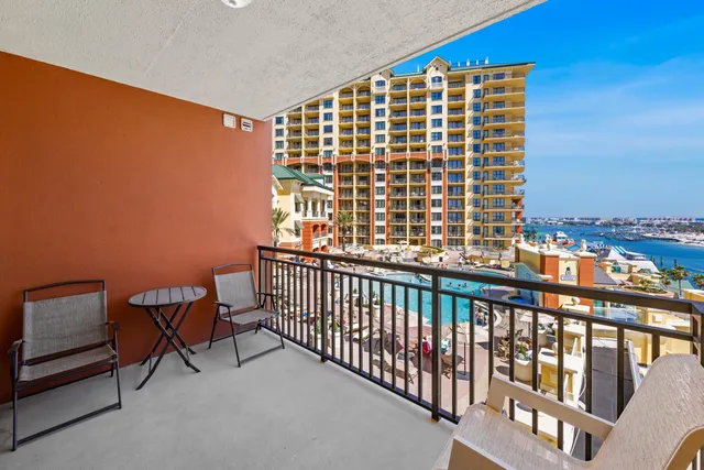 a view of a balcony with furniture and a fireplace