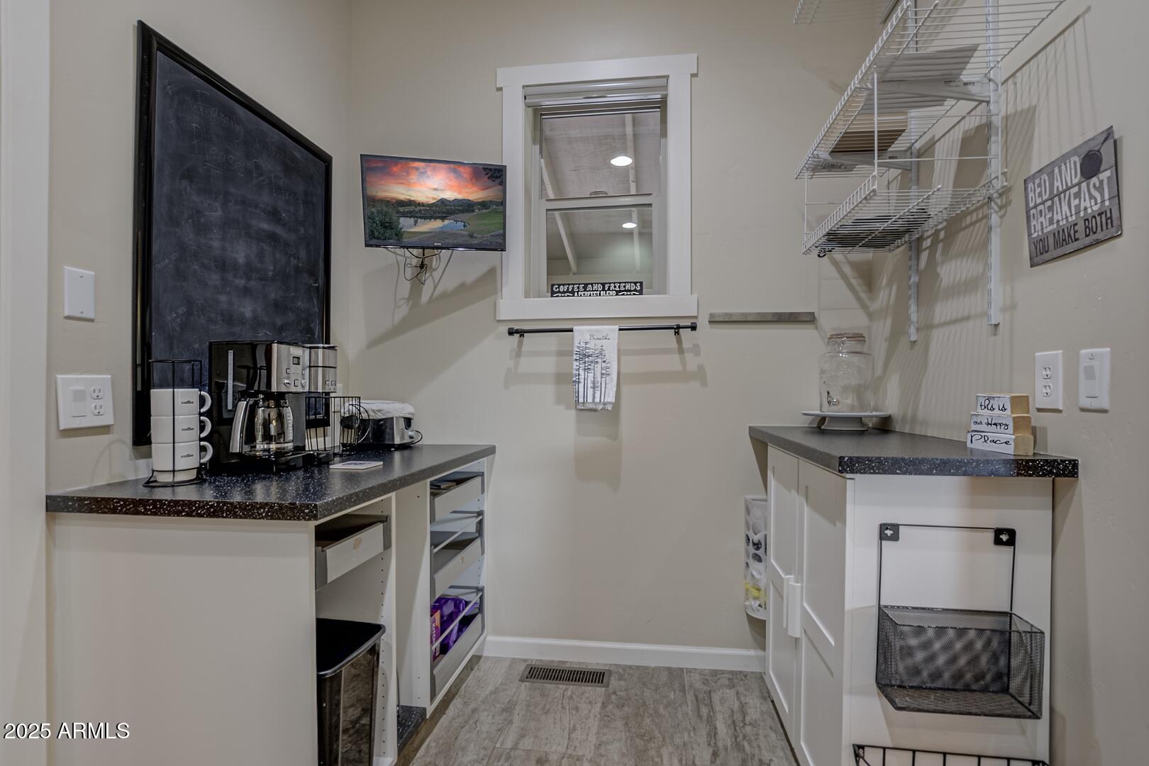 5076 Juniper Loop Pine, AZ 85544 - Photo 16 of 68 a kitchen with stainless steel appliances granite countertop a sink and cabinets