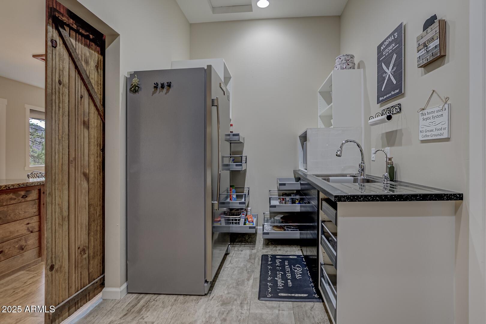 5076 Juniper Loop Pine, AZ 85544 - Photo 17 of 68 a kitchen with stainless steel appliances granite countertop a refrigerator and a stove