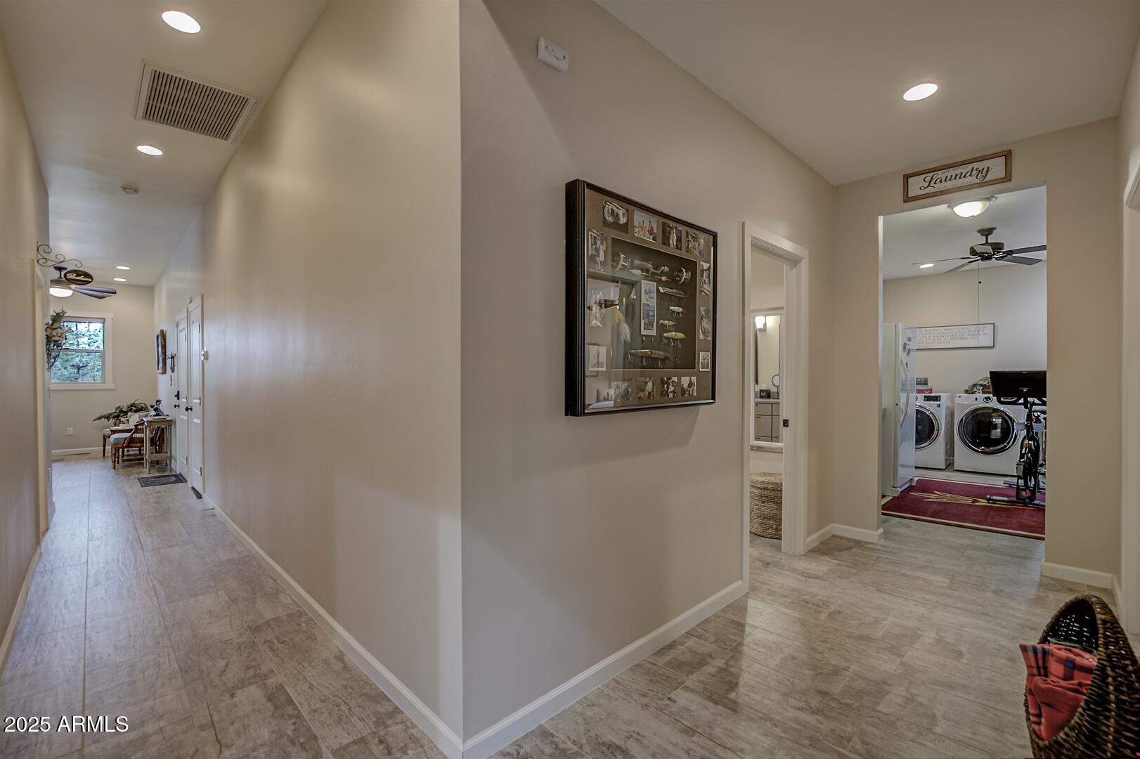 5076 Juniper Loop Pine, AZ 85544 - Photo 18 of 68 a hallway with a view of the bathroom
