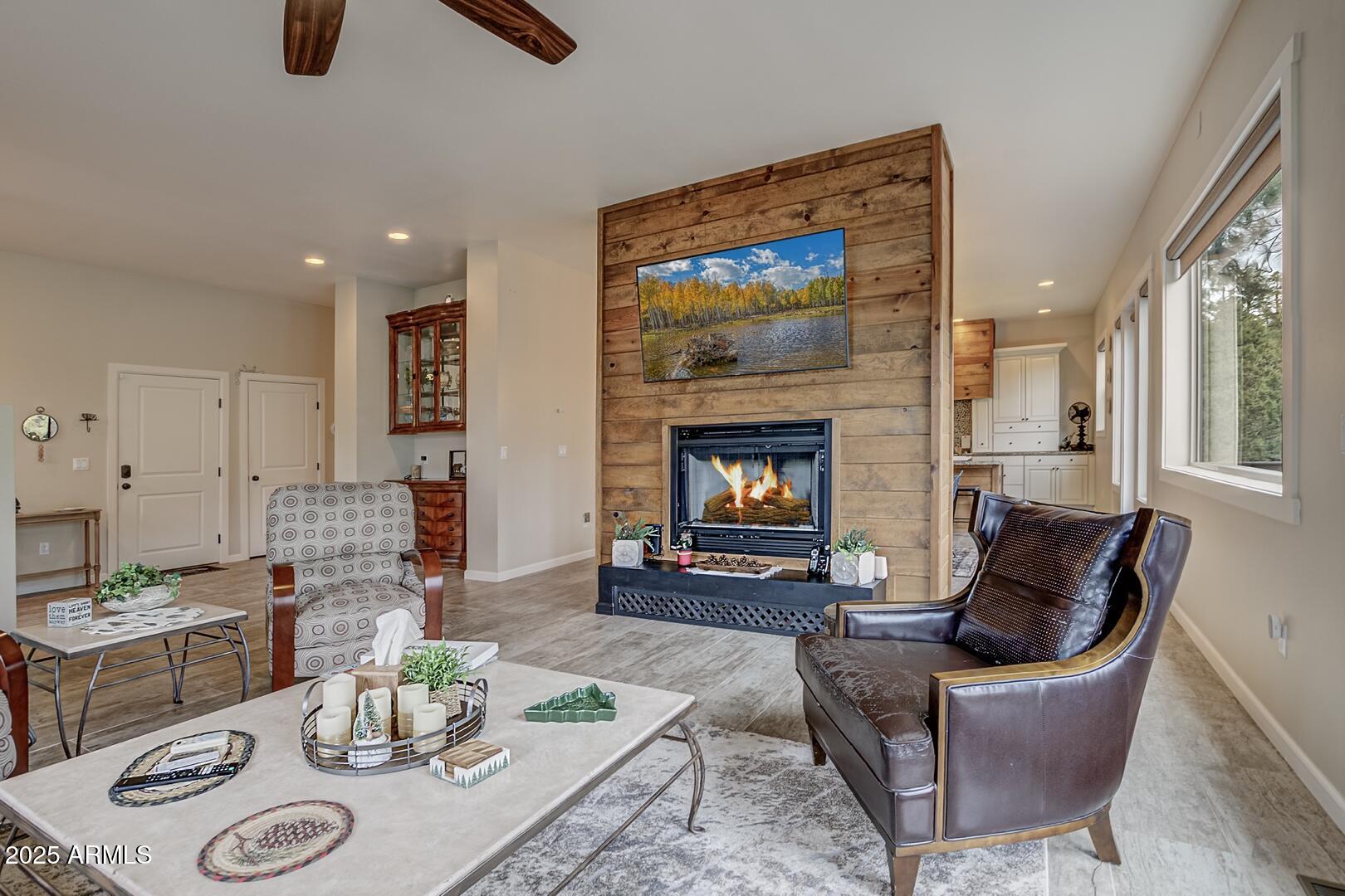 5076 Juniper Loop Pine, AZ 85544 - Photo 3 of 68 a living room with furniture and a fireplace