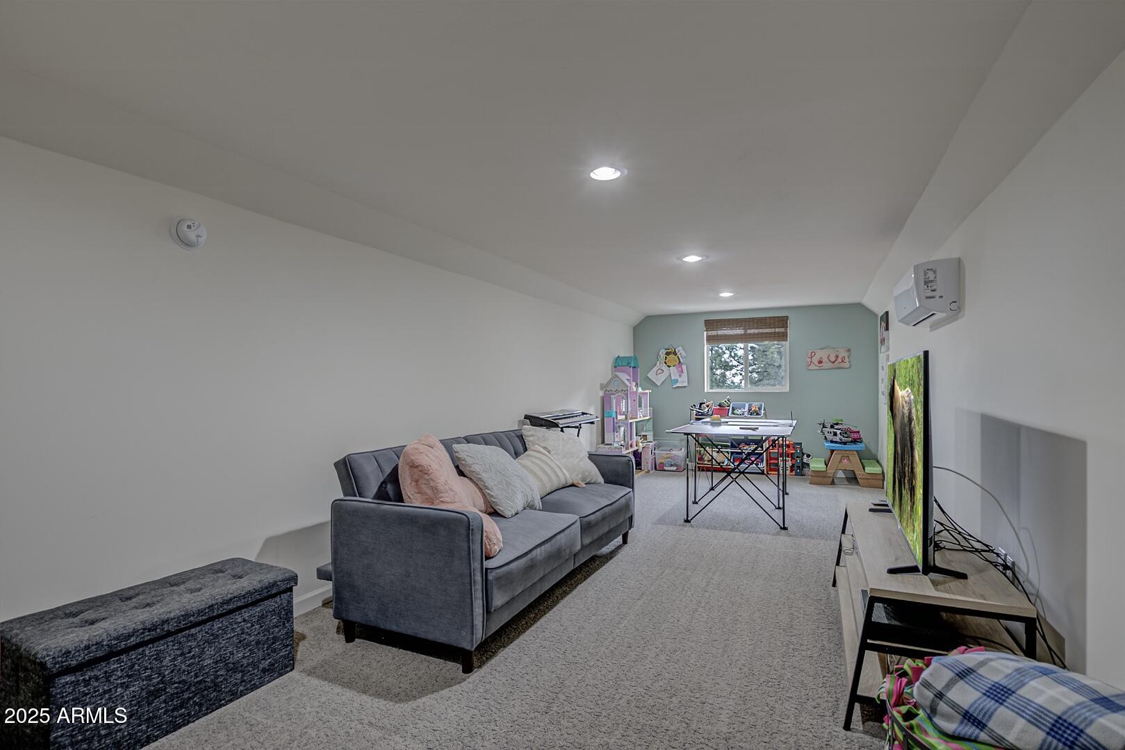 5076 Juniper Loop Pine, AZ 85544 - Photo 35 of 68 a living room with furniture and a couch
