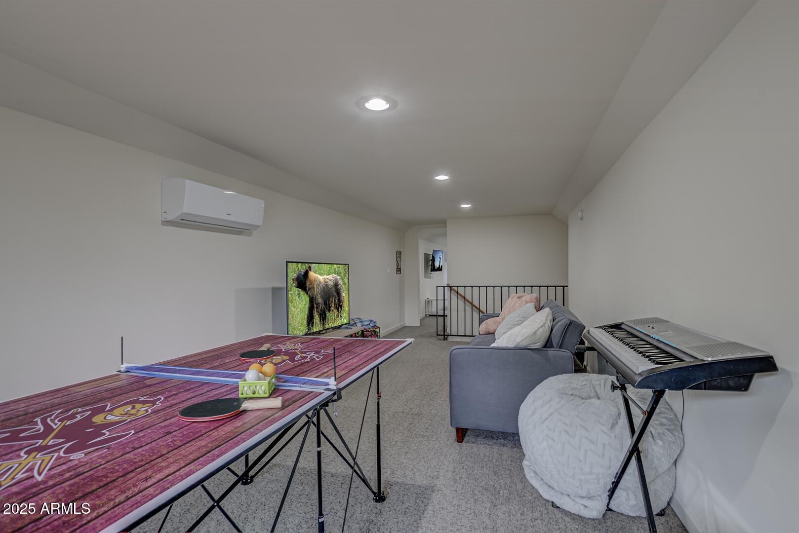 5076 Juniper Loop Pine, AZ 85544 - Photo 36 of 68 a living room with furniture and wooden floor