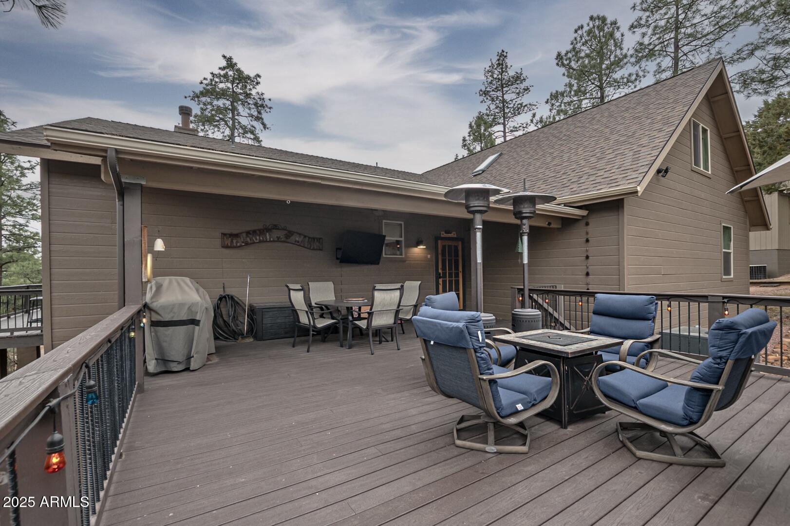 5076 Juniper Loop Pine, AZ 85544 - Photo 42 of 68 a view of a patio with table and chairs