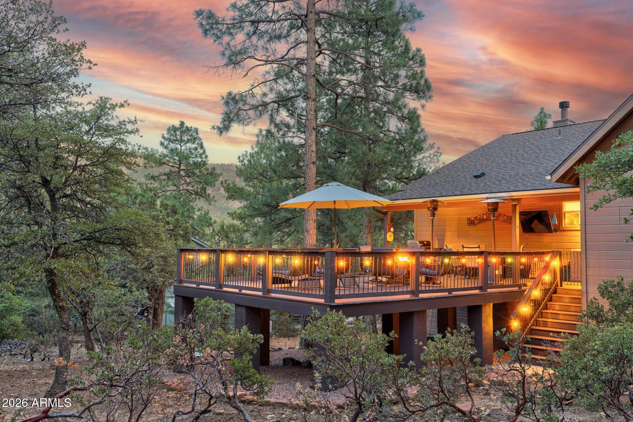5076 Juniper Loop Pine, AZ 85544 - Photo 43 of 68 a view of a chairs and table in the backyard