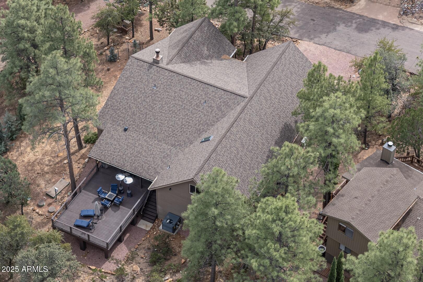 5076 Juniper Loop Pine, AZ 85544 - Photo 48 of 68 an aerial view of a house with a yard and outdoor seating