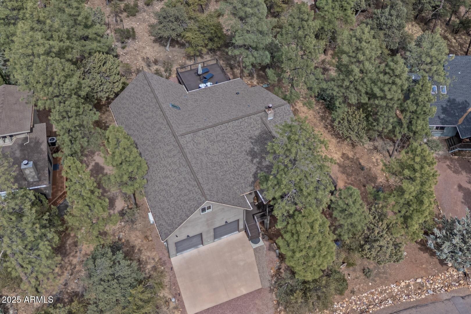 5076 Juniper Loop Pine, AZ 85544 - Photo 50 of 68 an aerial view of a house with a yard