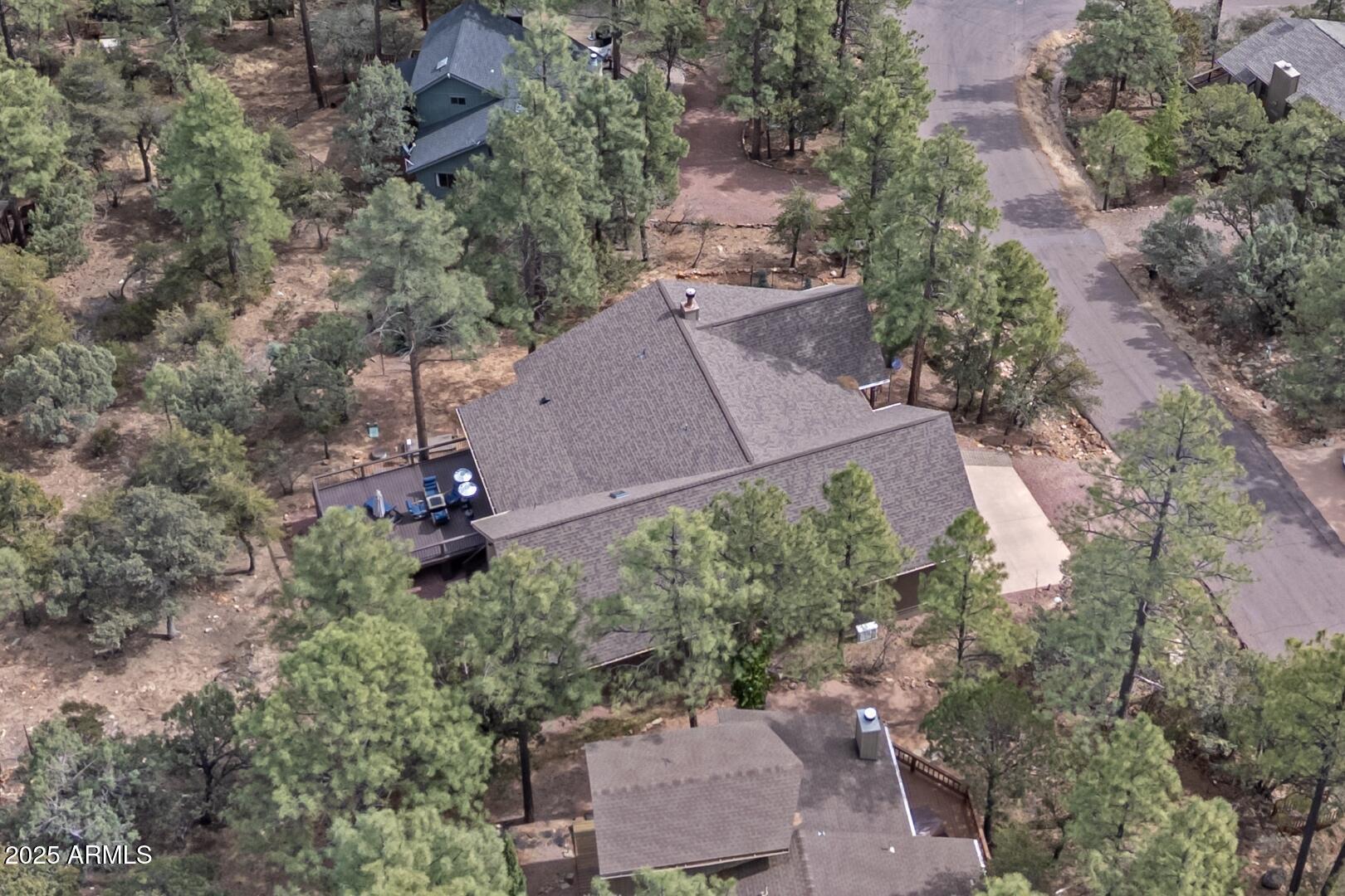 5076 Juniper Loop Pine, AZ 85544 - Photo 51 of 68 an aerial view of a house with a yard