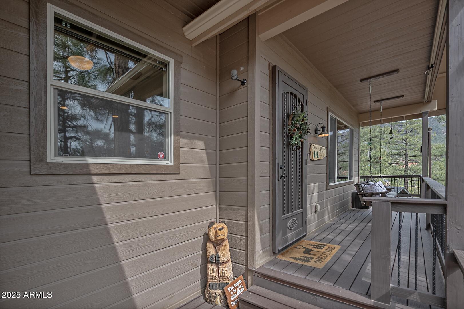 5076 Juniper Loop Pine, AZ 85544 - Photo 55 of 68 a view of a door and wooden floor