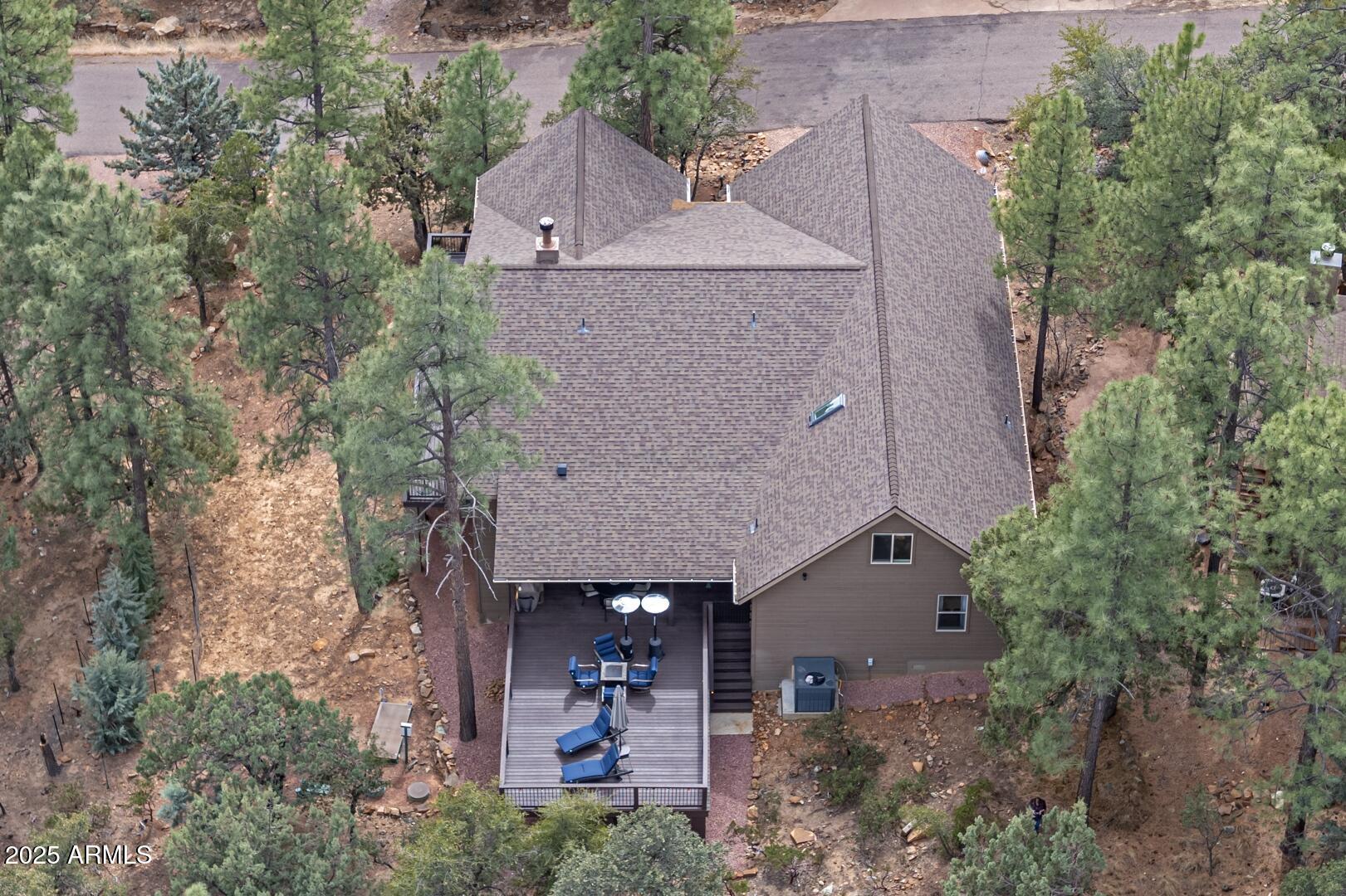 5076 Juniper Loop Pine, AZ 85544 - Photo 64 of 68 an aerial view of a house with a yard and potted plants