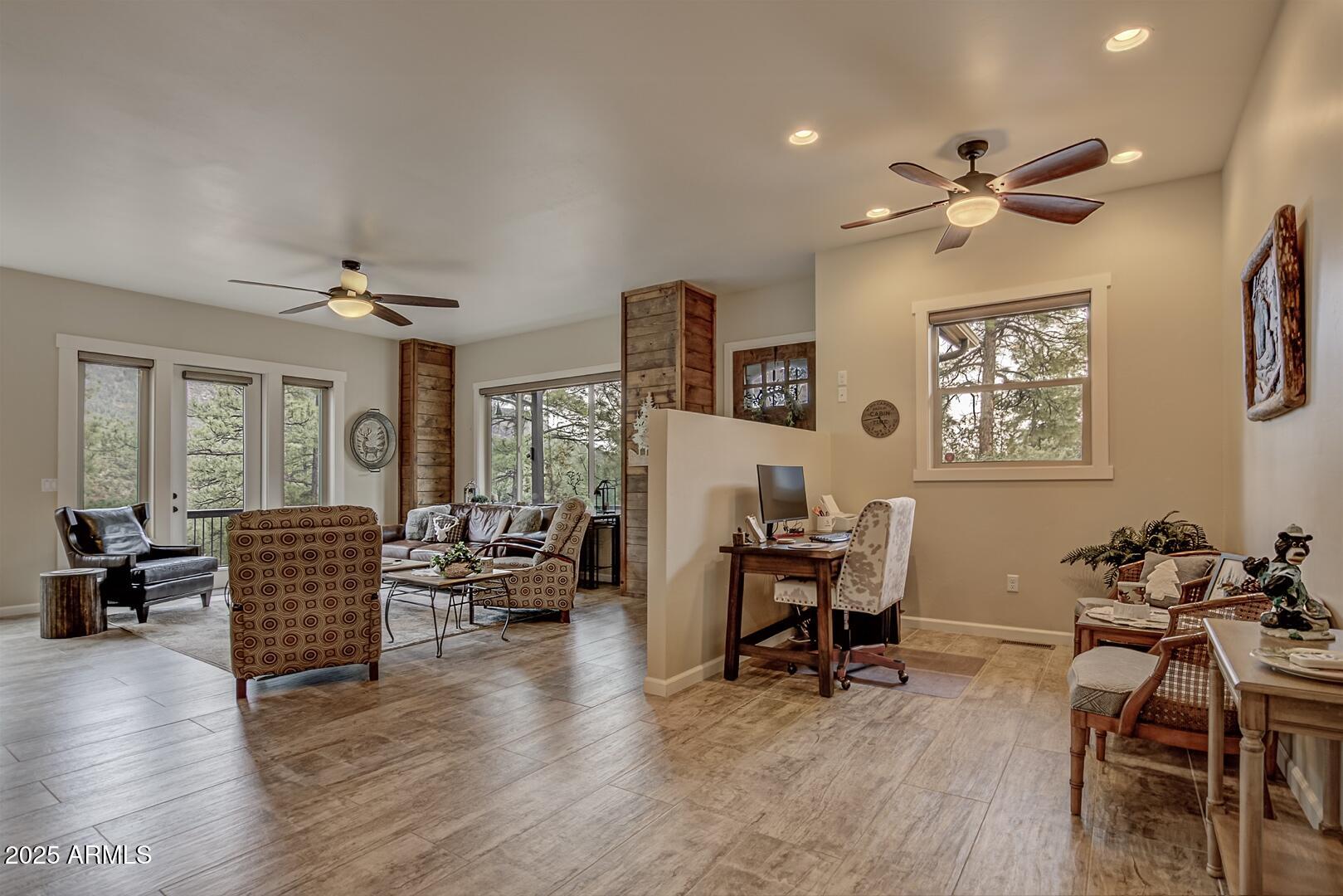 5076 Juniper Loop Pine, AZ 85544 - Photo 8 of 68 a living room with furniture and wooden floor