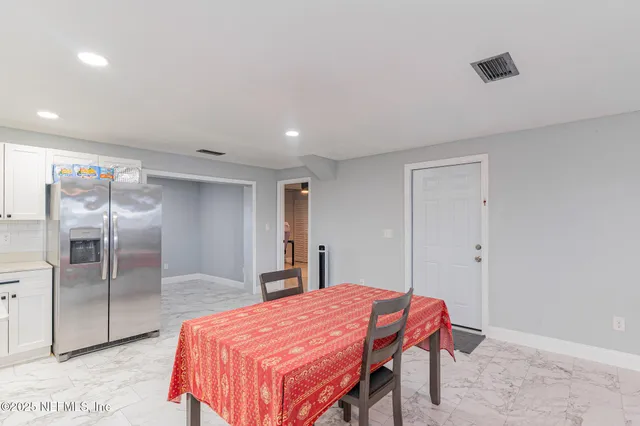 a room with a bed and a dresser