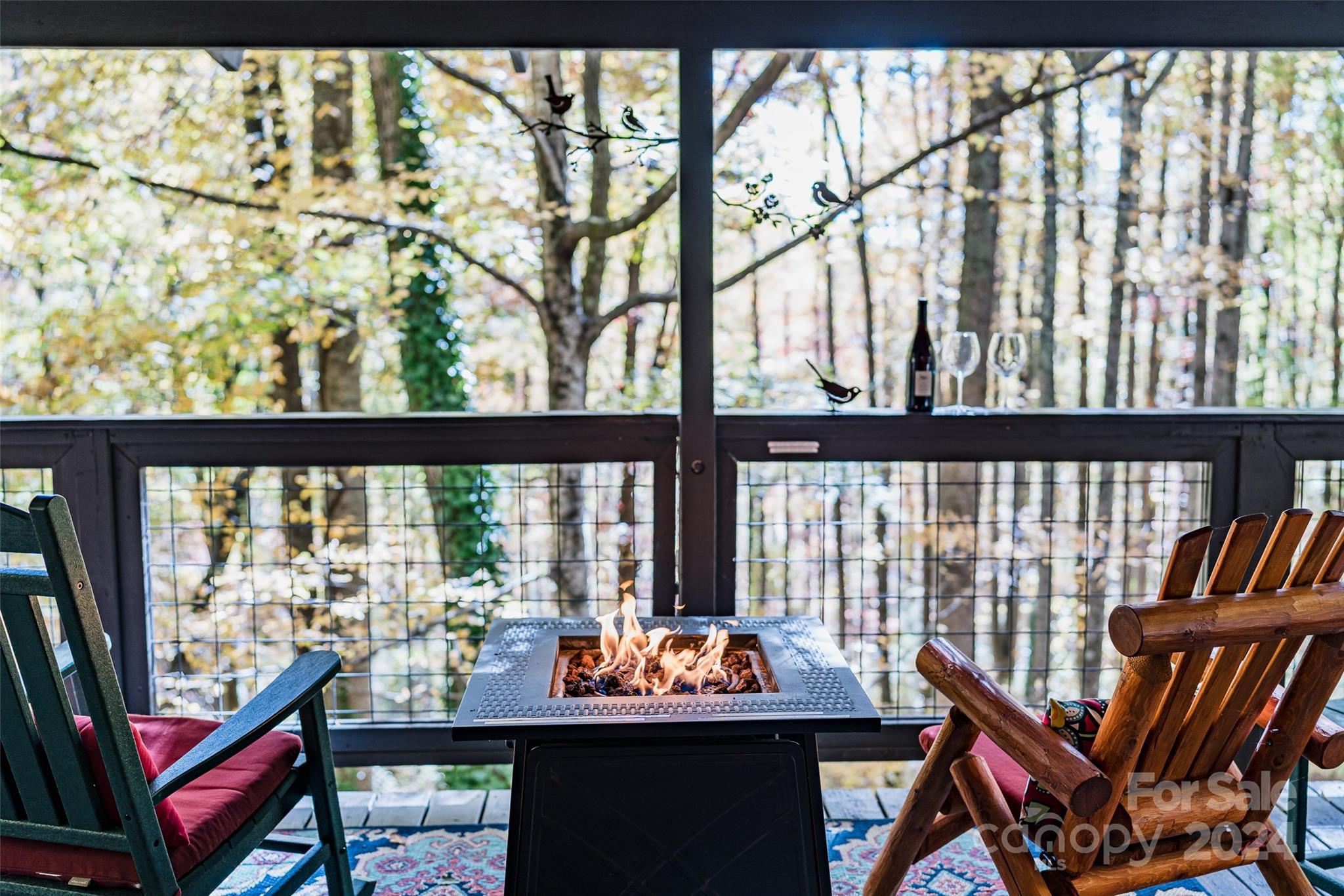 62 Weeping Cherry Forest Road Fairview, NC 28730 - Photo 10 of 48 a outdoor room with chairs and furniture