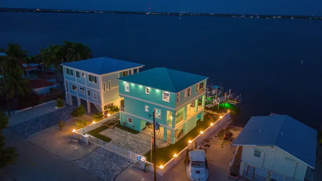 a view of a chairs and table in the balcony