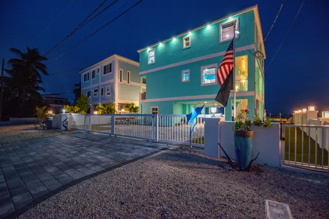 a outdoor view with a sitting space and large trees