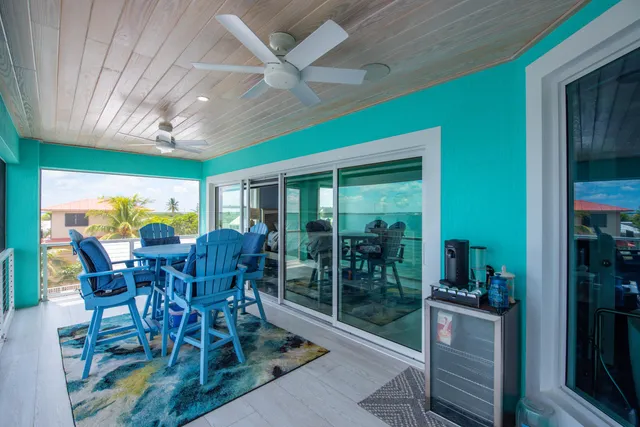 a kitchen with granite countertop stainless steel appliances cabinets a sink and a large window