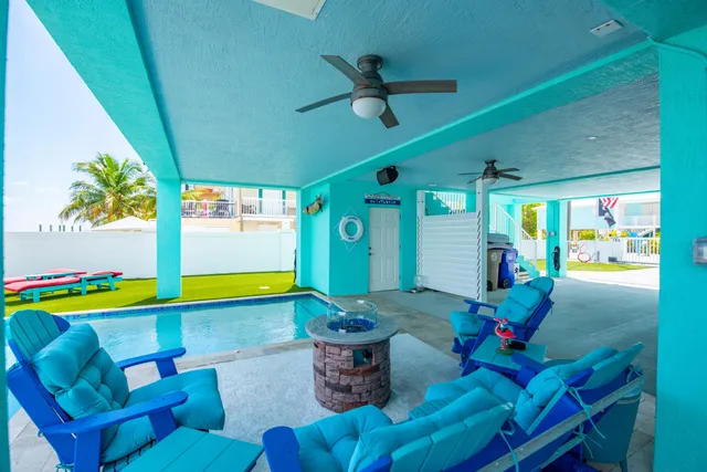 a bathroom with a granite countertop toilet and a sink