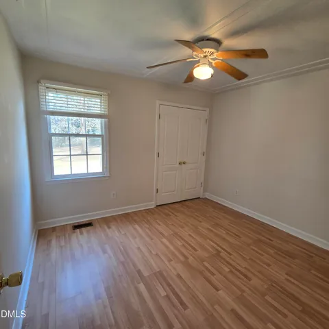 a view of a lake with houses in the back