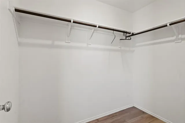 a view of an empty walk in closet