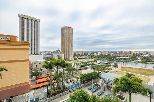 a swimming pool with outdoor seating and yard