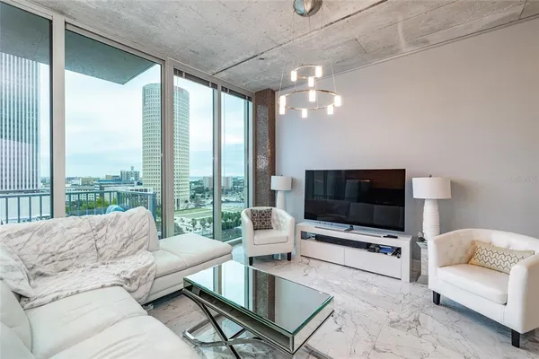 a living room with furniture and a flat screen tv