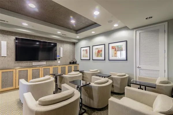 a room with pool table and flat screen tv