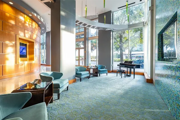 a view of swimming pool with outdoor seating and lake view