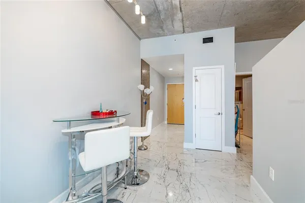 a kitchen with stainless steel appliances a refrigerator and sink