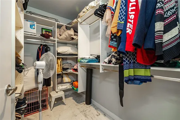 a bedroom with a bed and flat screen tv