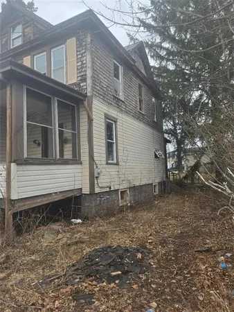 a house view with a backyard