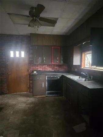 a kitchen with stainless steel appliances a sink stove and cabinets