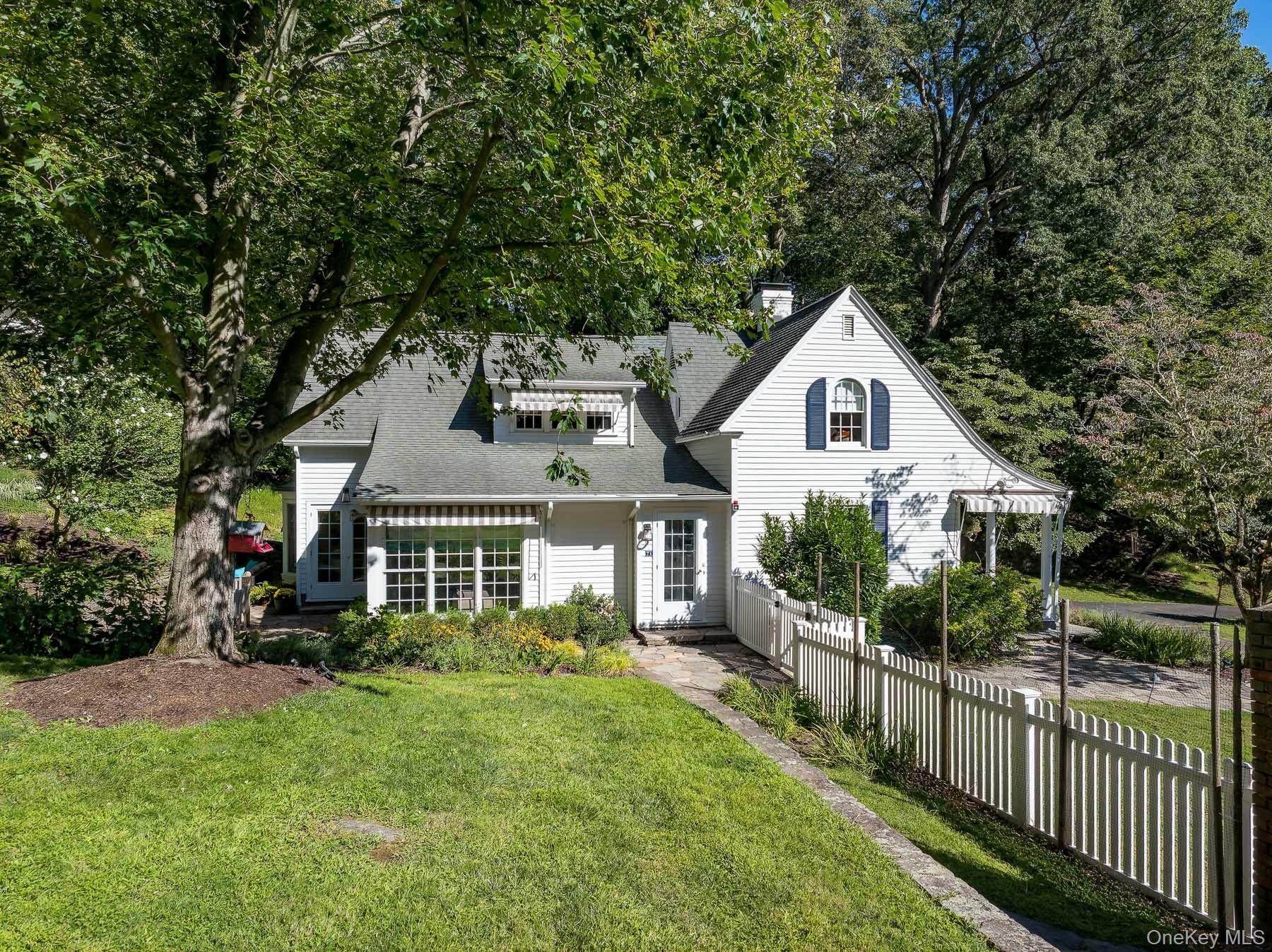 71 Havemeyer Road Irvington, NY 10533 - Photo 13 of 38 a front view of a house with a yard