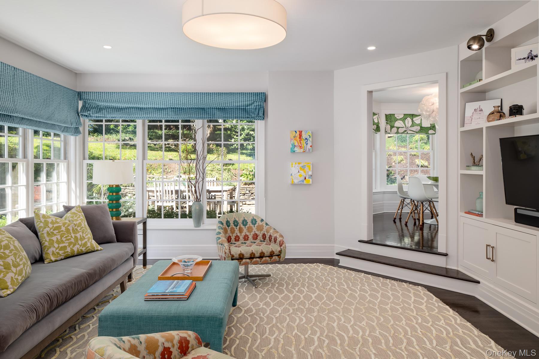 71 Havemeyer Road Irvington, NY 10533 - Photo 17 of 38 a bedroom with furniture and a flat screen tv