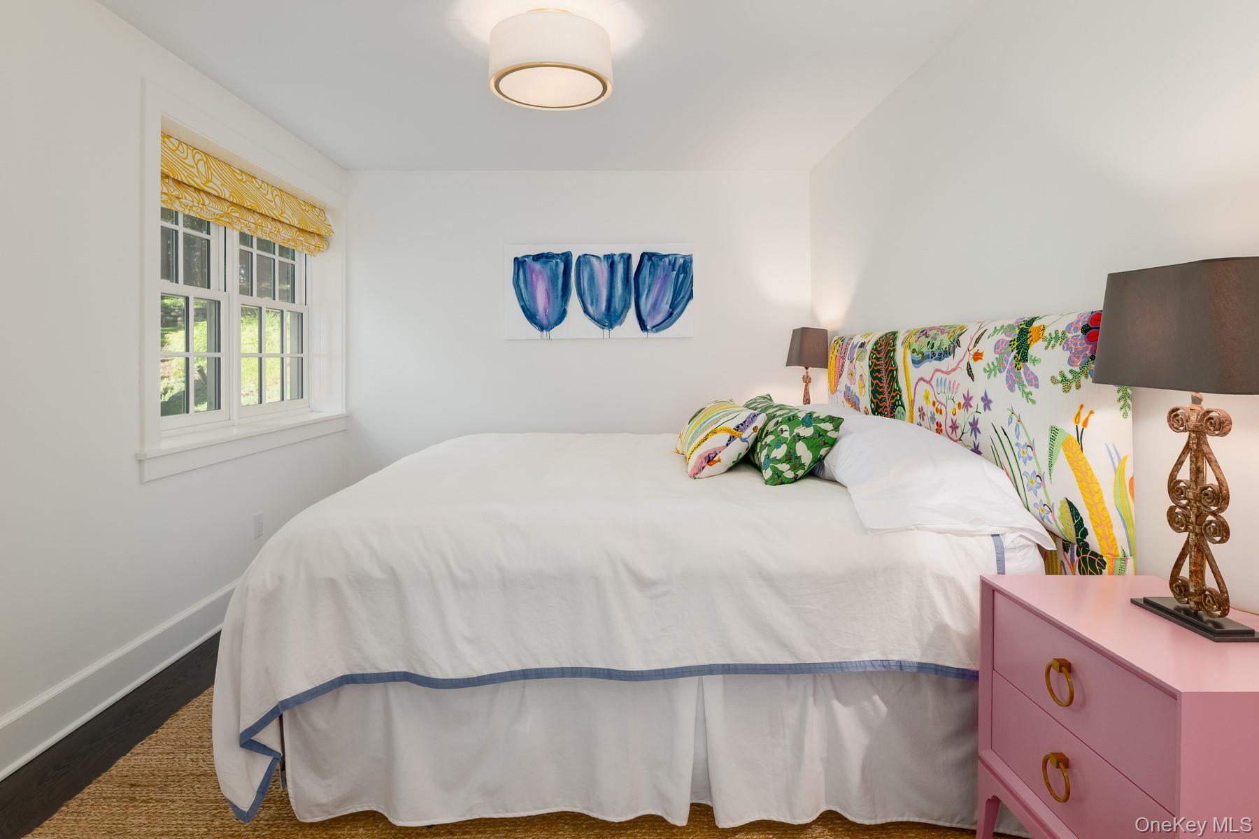 71 Havemeyer Road Irvington, NY 10533 - Photo 19 of 38 a bedroom with a bed and a flat screen tv