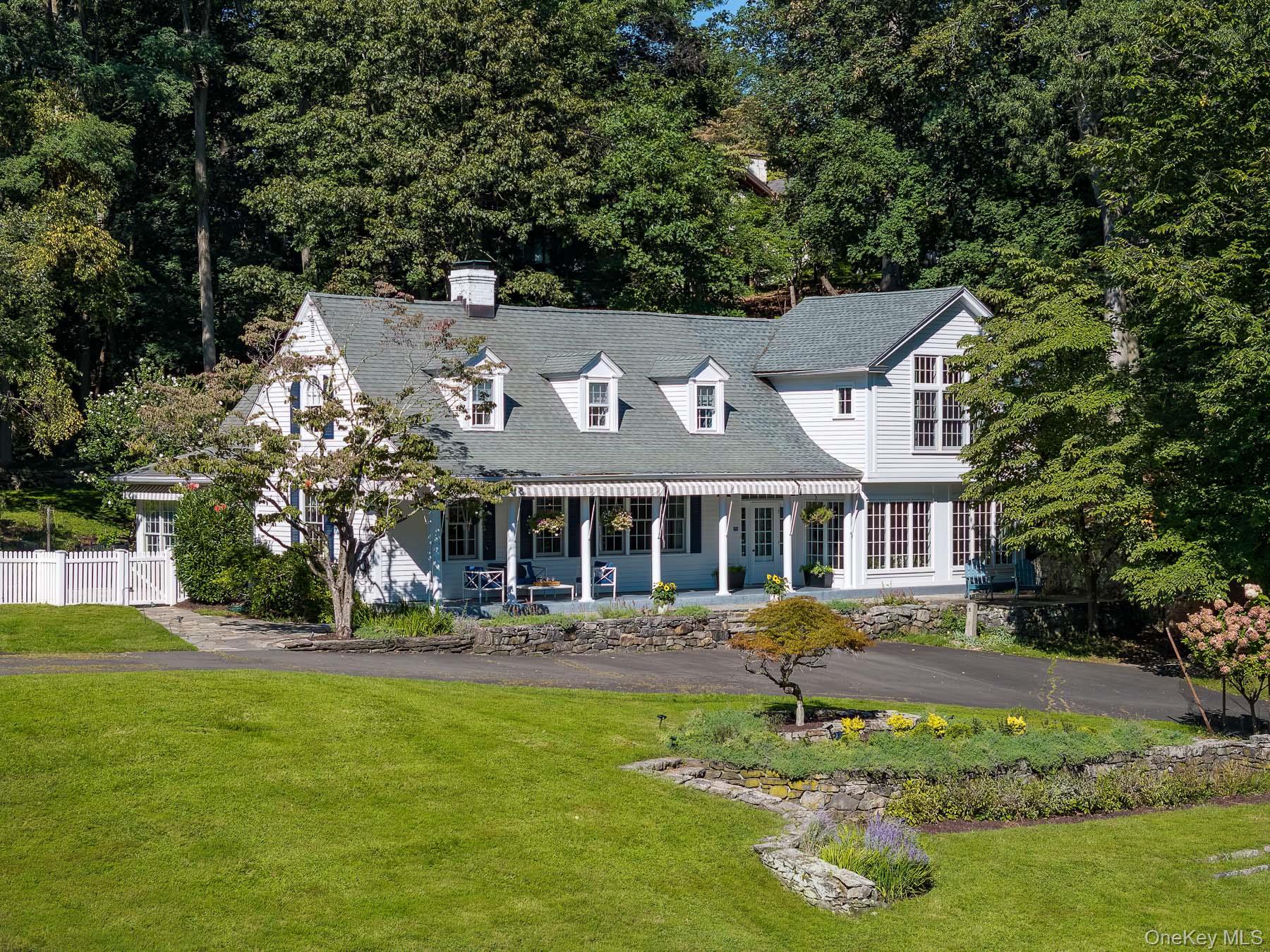 71 Havemeyer Road Irvington, NY 10533 - Photo 2 of 38 a front view of a house with a yard