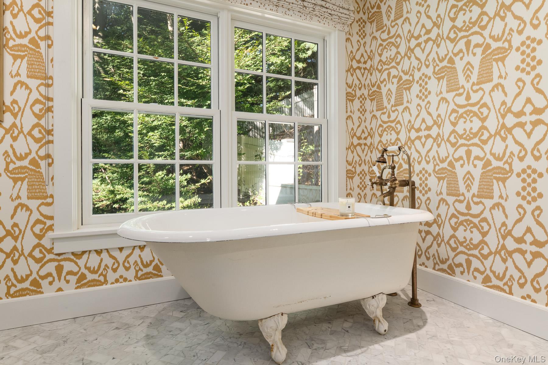 71 Havemeyer Road Irvington, NY 10533 - Photo 24 of 38 a bathroom with a bathtub and window