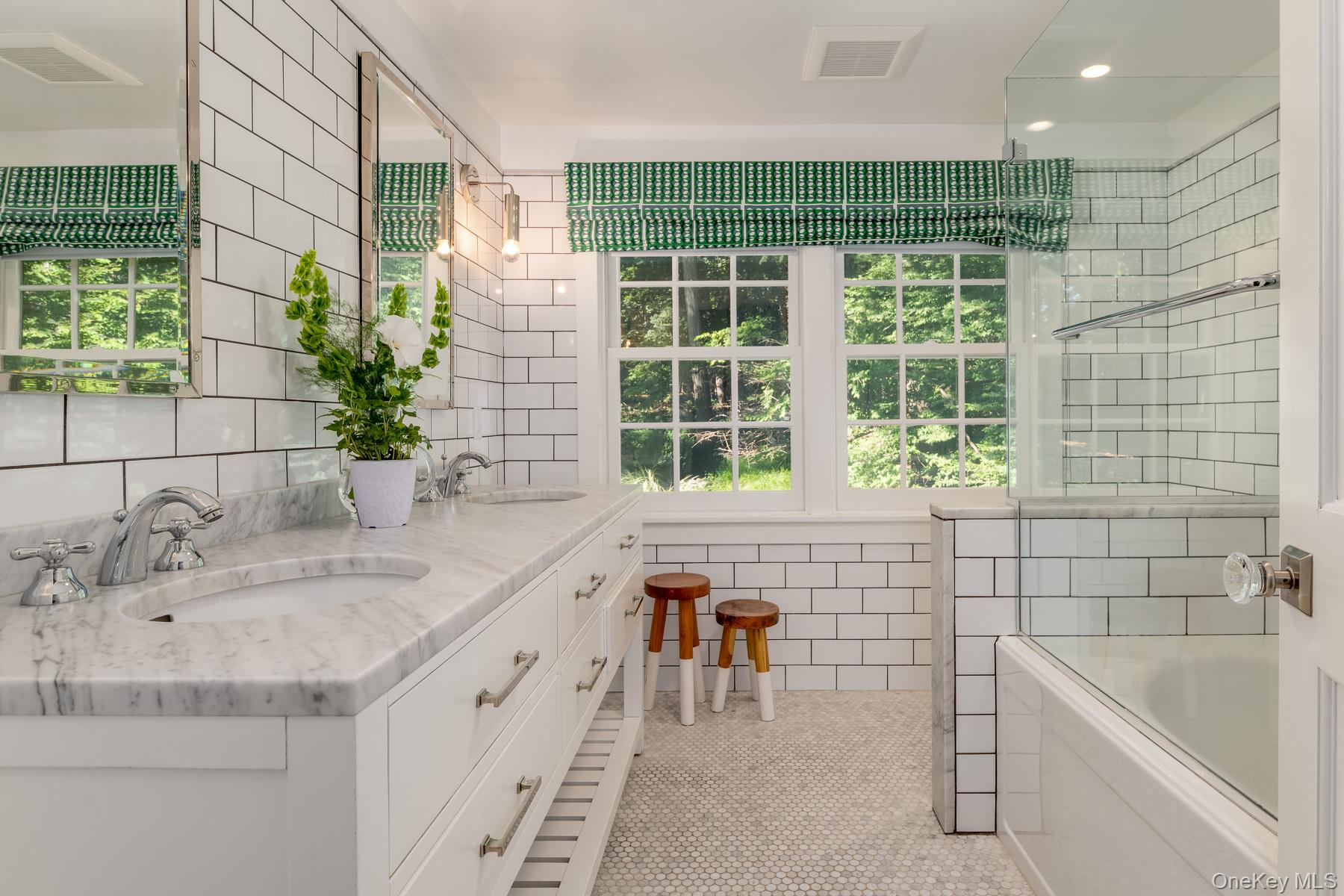 71 Havemeyer Road Irvington, NY 10533 - Photo 26 of 38 a bathroom with a tub a sink a window and a shower