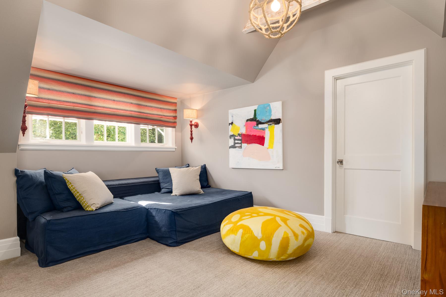 71 Havemeyer Road Irvington, NY 10533 - Photo 27 of 38 a living room with furniture and a chandelier