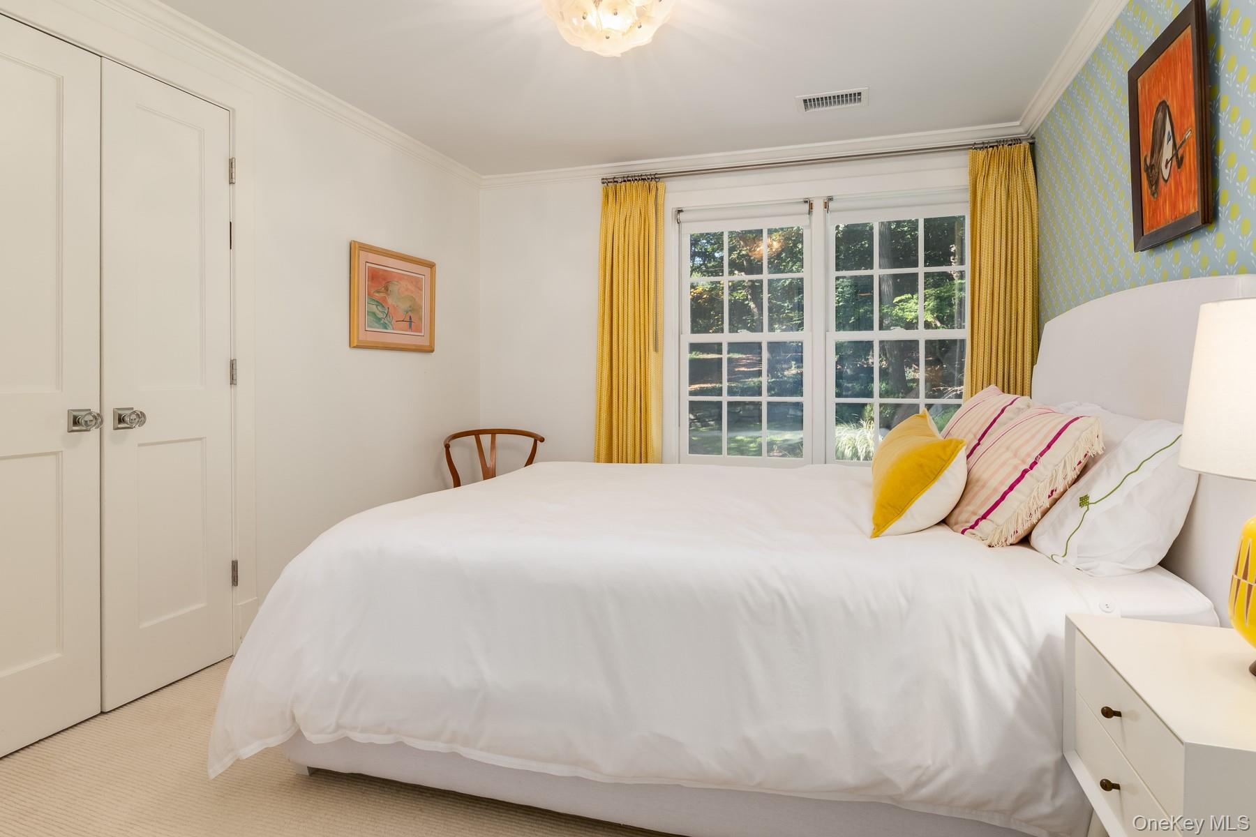 71 Havemeyer Road Irvington, NY 10533 - Photo 29 of 38 a bedroom with a bed and a large window