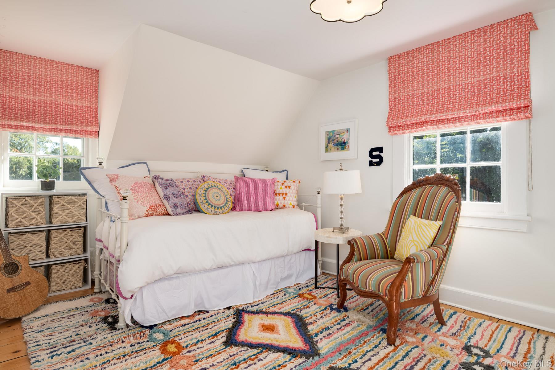 71 Havemeyer Road Irvington, NY 10533 - Photo 30 of 38 a bedroom with a bed a chair and a large window with outer view