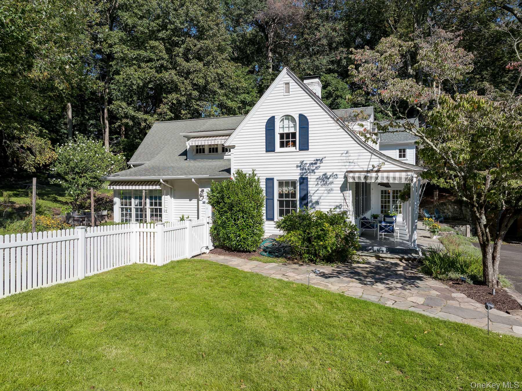 71 Havemeyer Road Irvington, NY 10533 - Photo 31 of 38 a front view of a house with a yard