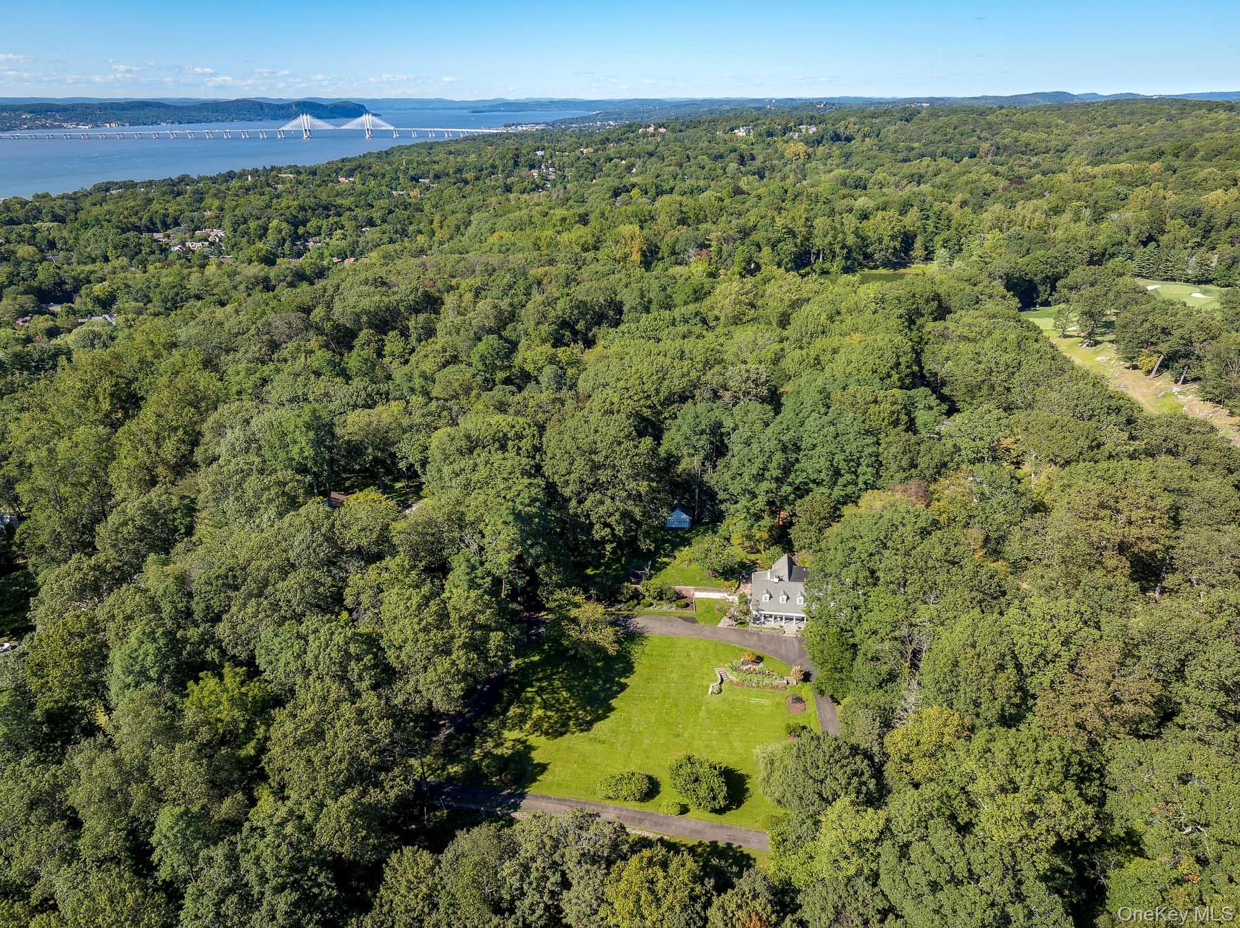 71 Havemeyer Road Irvington, NY 10533 - Photo 4 of 38 a view of a lake with a building in the background